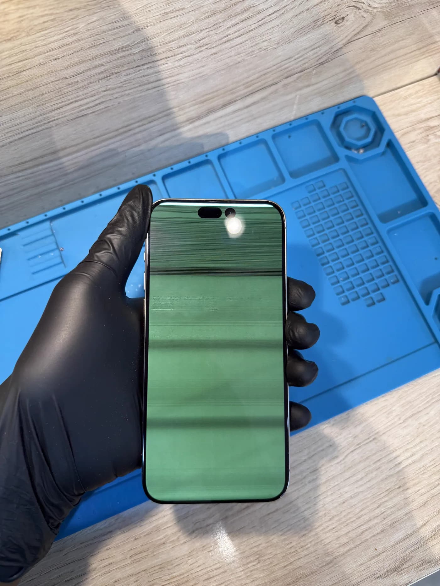 iPhone display showing green line damage before repair