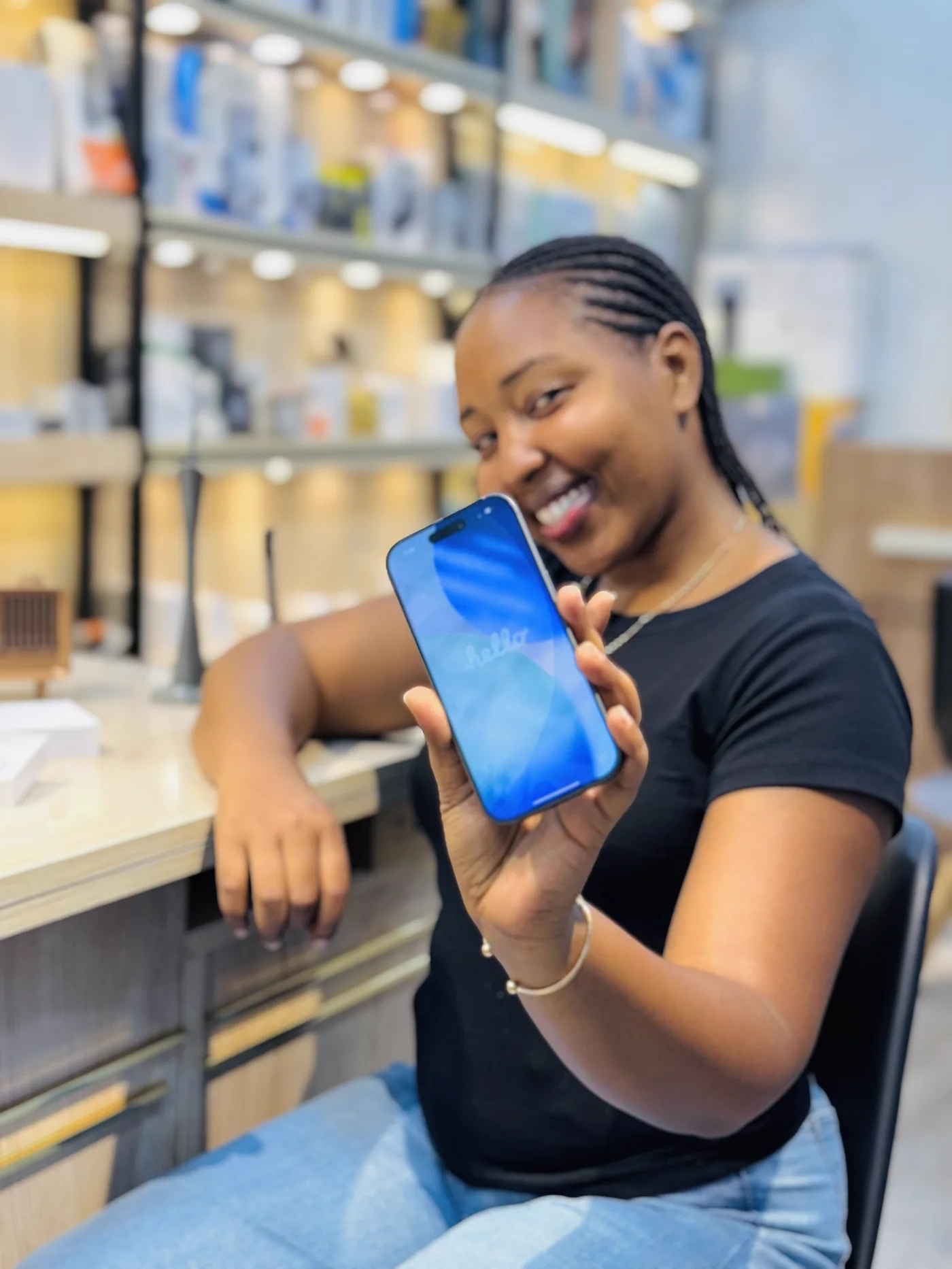 Smiling customer showing her working iPhone after service